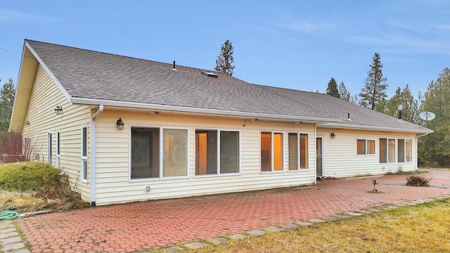 rear view of property featuring a patio area