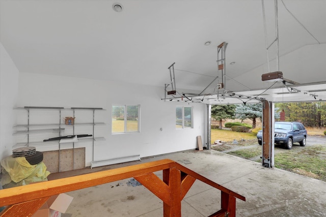 garage featuring a baseboard radiator and a garage door opener