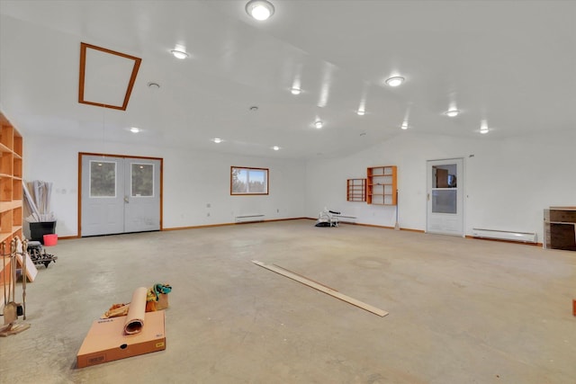 miscellaneous room featuring lofted ceiling and a baseboard heating unit