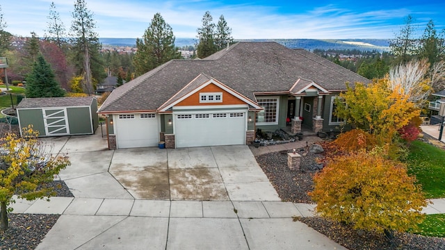 craftsman house featuring a mountain view and a shed