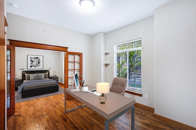 interior space featuring french doors and dark hardwood / wood-style floors