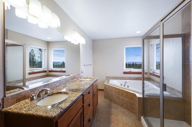 bathroom with tile patterned floors, vanity, and plus walk in shower