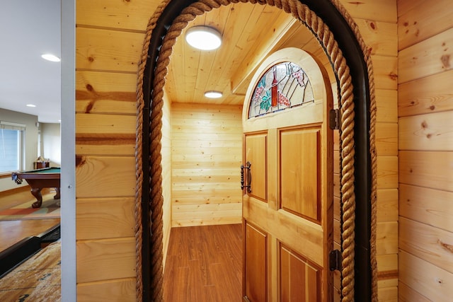 details featuring wood-type flooring, wooden walls, and wood ceiling