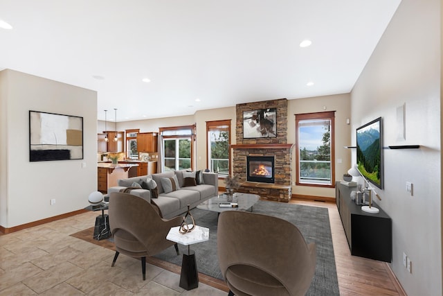 living room featuring a stone fireplace