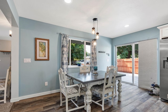 dining room with dark hardwood / wood-style floors