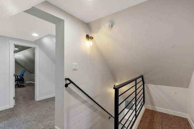 stairs with carpet floors and lofted ceiling