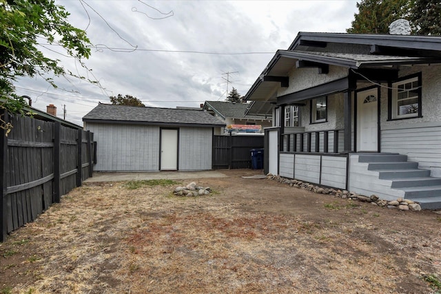 view of yard featuring a storage shed and covered porch