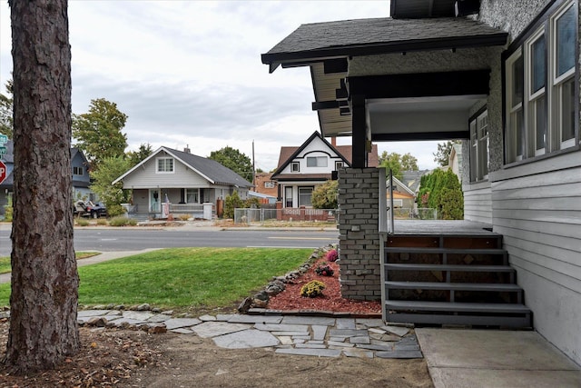 view of yard featuring covered porch