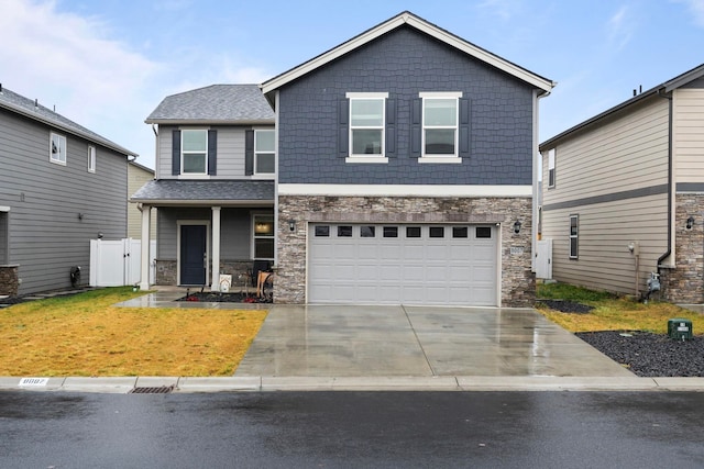 view of front of property with a garage and a front lawn