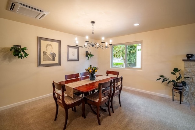 carpeted dining area featuring an inviting chandelier