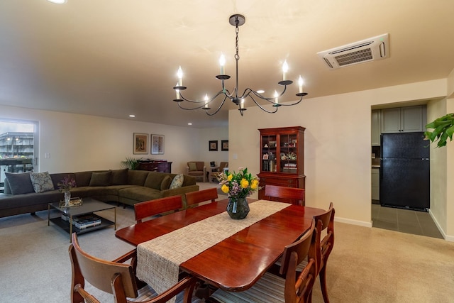 carpeted dining space with a notable chandelier