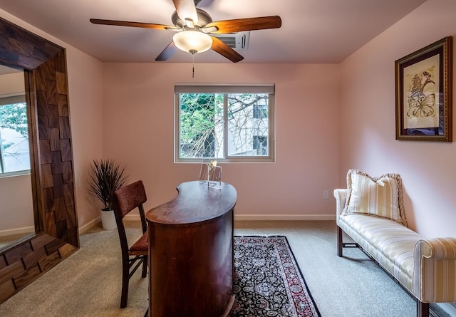 dining room with ceiling fan and carpet floors