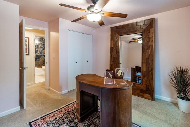 office featuring ceiling fan and light colored carpet