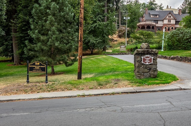 view of property's community with a lawn