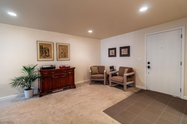 living area featuring dark colored carpet