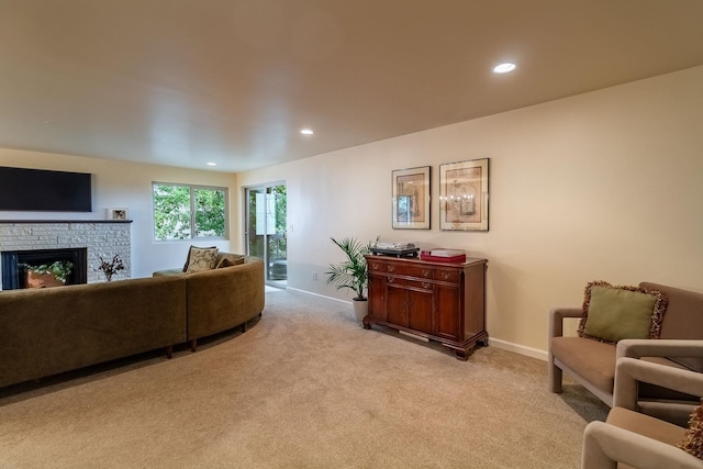 carpeted living room with a fireplace