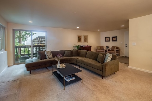 living room featuring light carpet