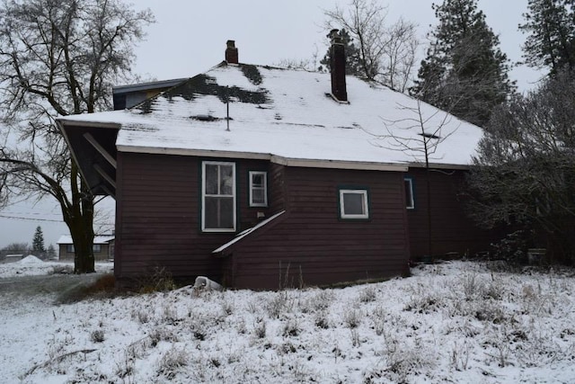 view of snow covered property