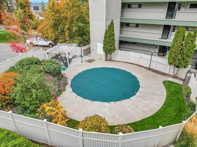 view of swimming pool featuring a patio area