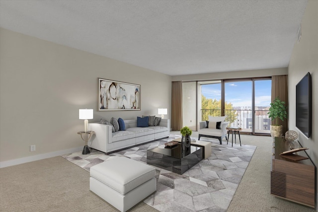 carpeted living room featuring a textured ceiling