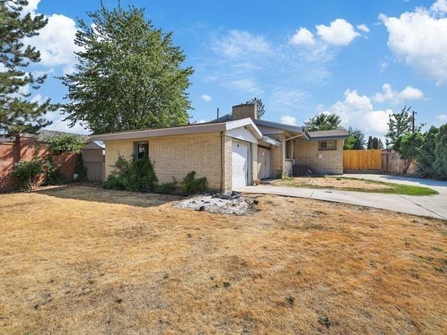 ranch-style house featuring a garage