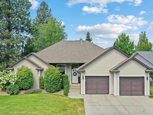 view of front facade featuring a garage and a front yard