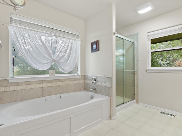 bathroom featuring plus walk in shower