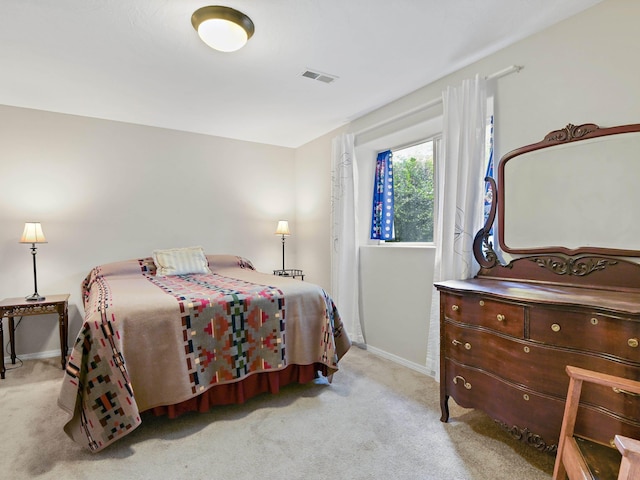 bedroom with light colored carpet