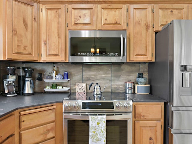 kitchen featuring tasteful backsplash, light brown cabinetry, and stainless steel appliances