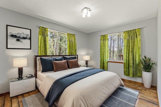 bedroom with hardwood / wood-style flooring