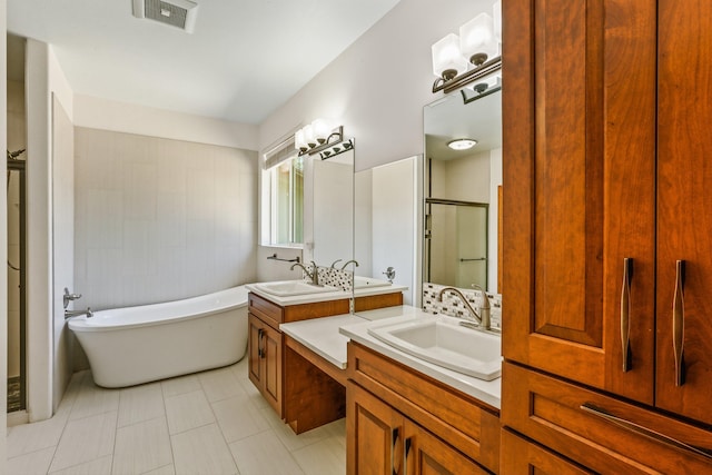 bathroom with tile patterned flooring, vanity, and separate shower and tub