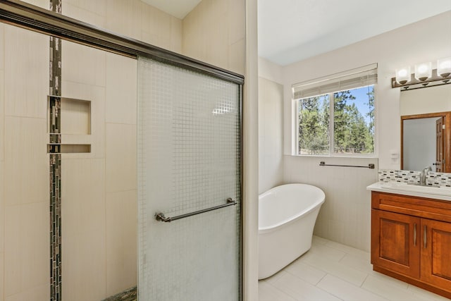 bathroom featuring decorative backsplash, vanity, independent shower and bath, and tile patterned flooring