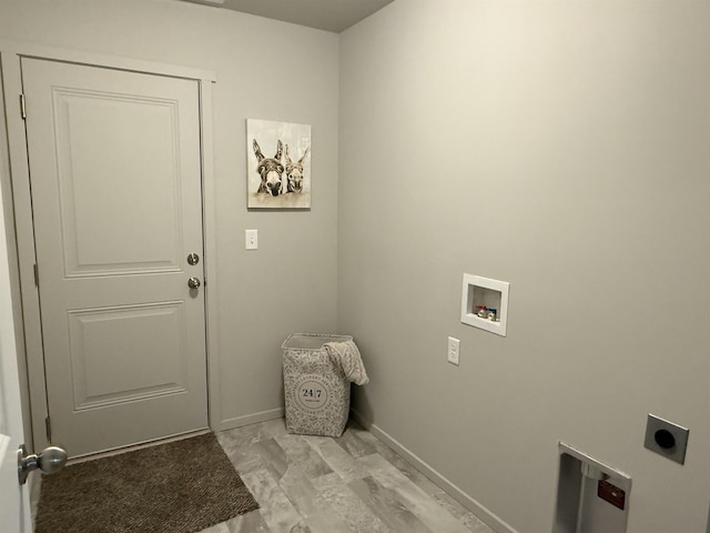 washroom with laundry area, hookup for an electric dryer, baseboards, and washer hookup