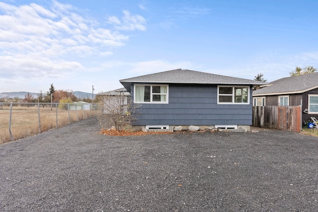 view of side of home with a mountain view