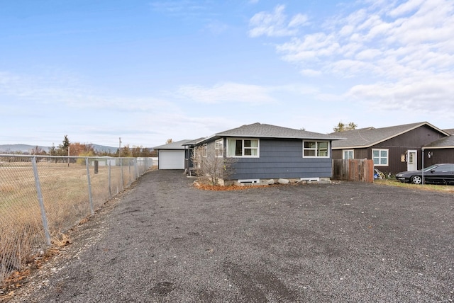 single story home featuring a garage