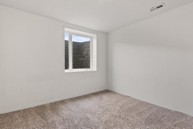 spare room featuring carpet flooring