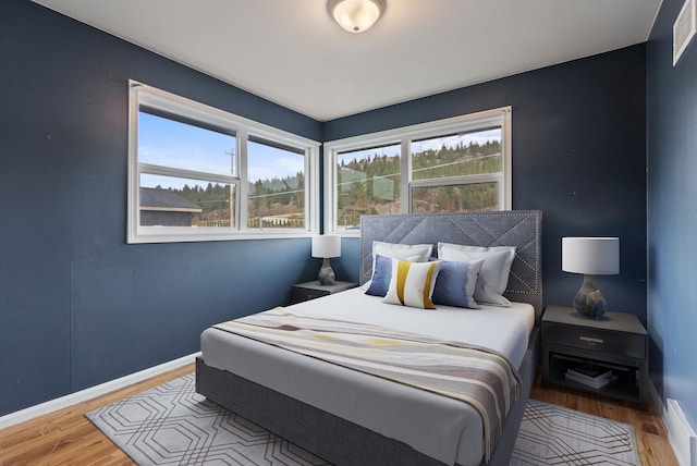 bedroom featuring wood-type flooring