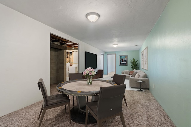 dining space featuring carpet floors