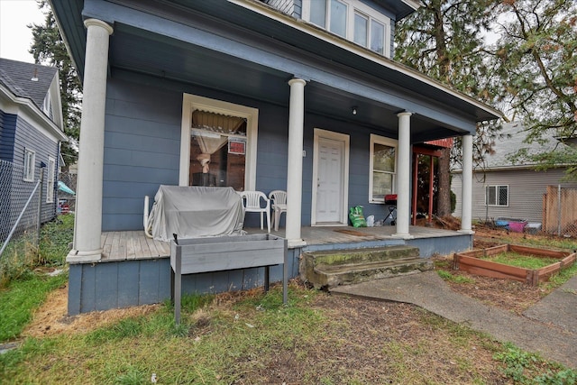 doorway to property featuring a porch