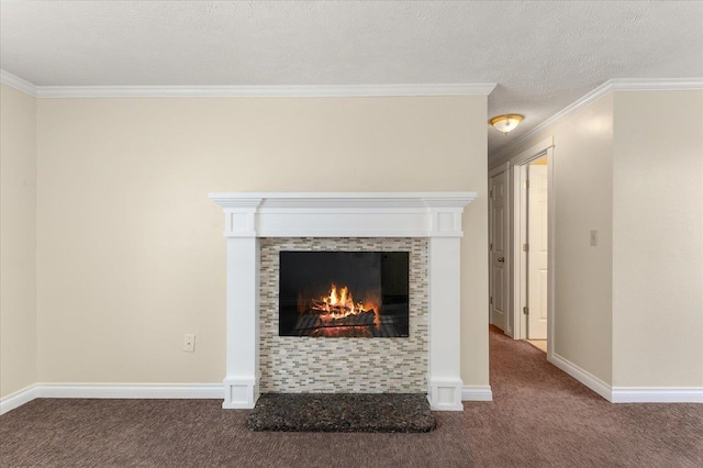 interior details featuring carpet, ornamental molding, a textured ceiling, and a tile fireplace