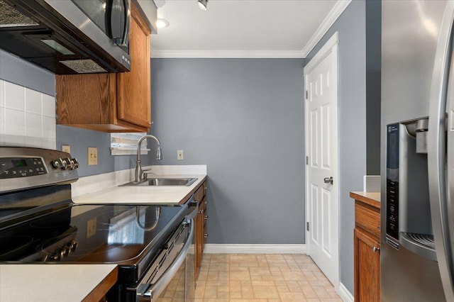 kitchen featuring crown molding, sink, and appliances with stainless steel finishes