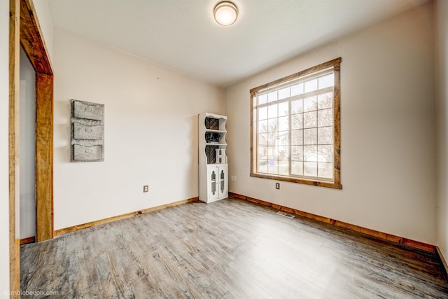 empty room featuring hardwood / wood-style floors