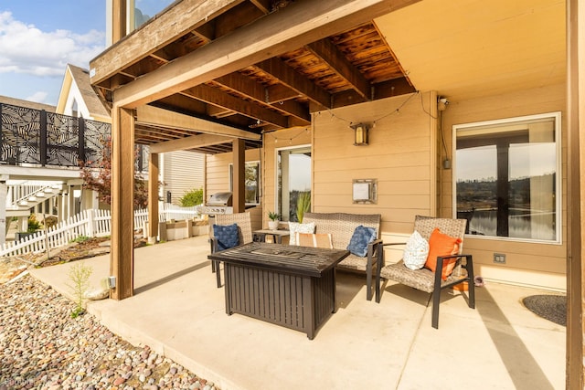 view of patio / terrace with an outdoor living space and a grill