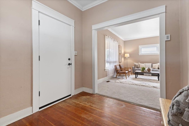 foyer with hardwood / wood-style flooring and ornamental molding