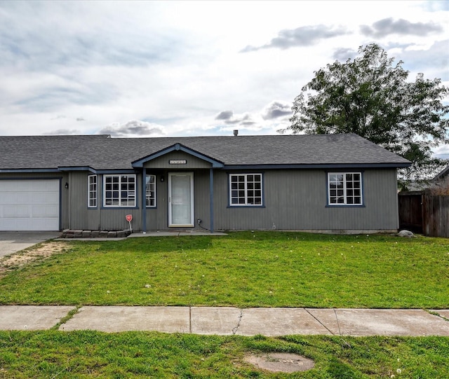 ranch-style house with a front lawn and a garage