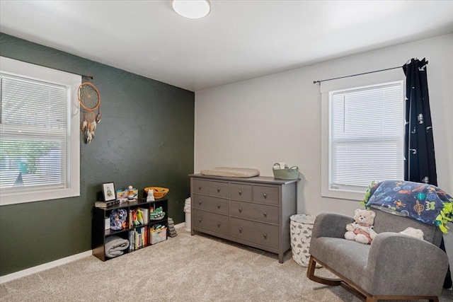 living area with light colored carpet