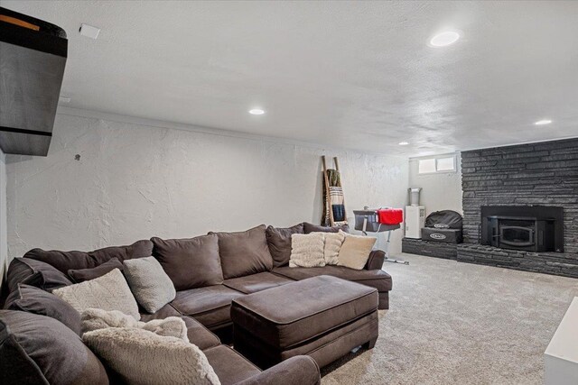 carpeted living room featuring a textured ceiling