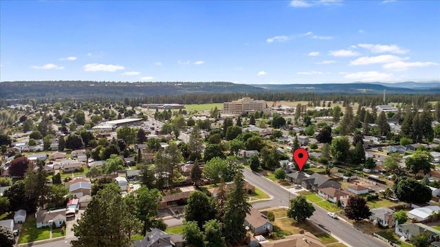 birds eye view of property with a mountain view