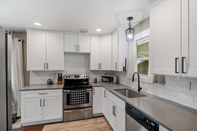 kitchen featuring white cabinets, sink, and stainless steel appliances