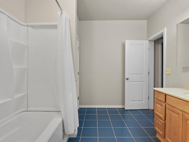 bathroom with shower / tub combo, vanity, and tile patterned floors